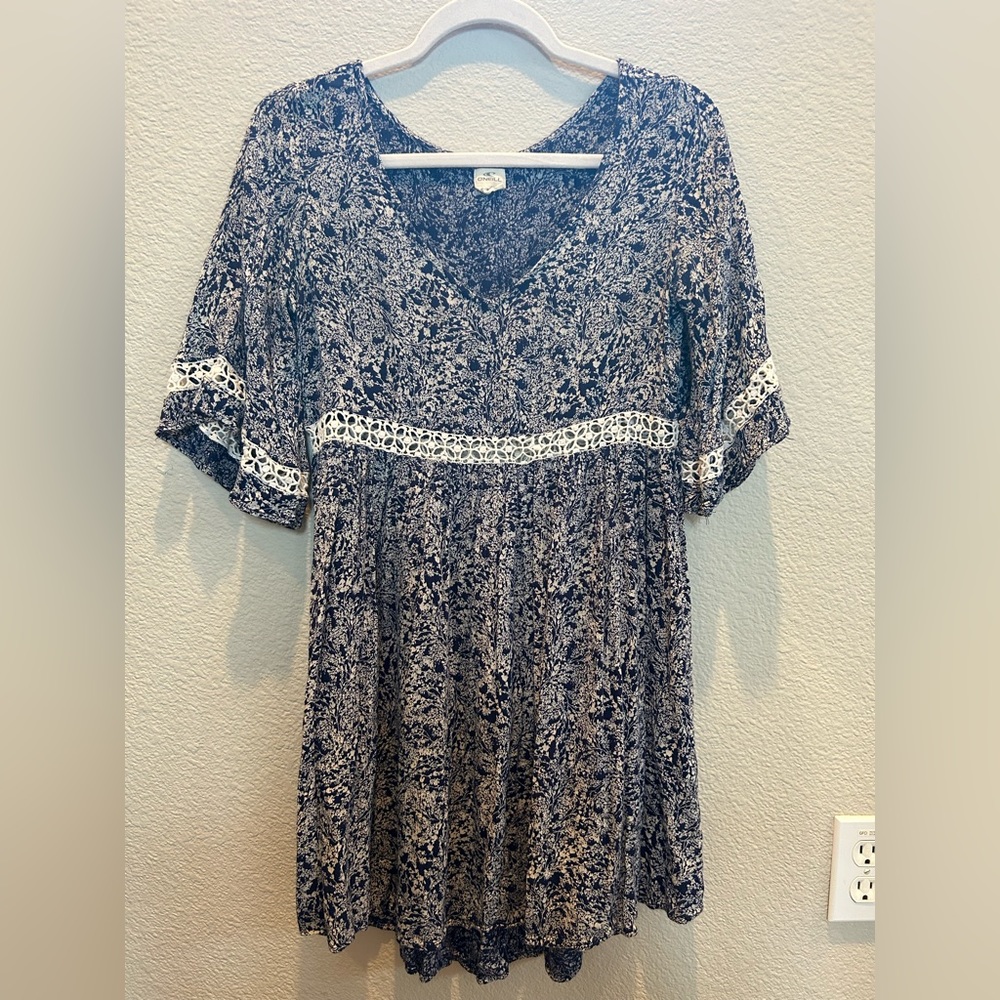 A small O’Niell dress that is navy with a pretty floral print.